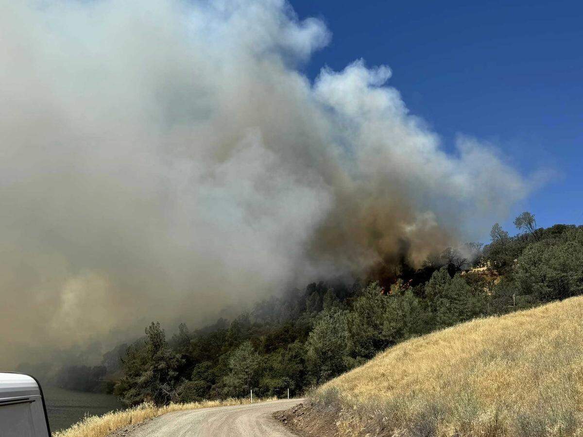 Smoke was billowing from the Thompson Fire burning Tuesday, July 2, 2024, and prompting evacuation orders in Butte County, near Oroville, California.