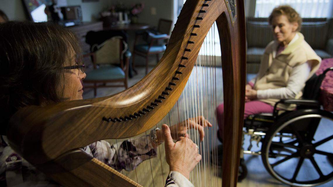 Music Partners in Health musician, Elizabeth Proett, plays the harp for Patricia Cavallini at Eskaton Care Center in Fair Oaks on Dec. 4, 2018. Carmichael’s Eskaton is again growing its footprint in the San Francisco Bay Area as the nonprofit senior care company girds for competition with rapidly expanding businesses with billion-dollar balance sheets.