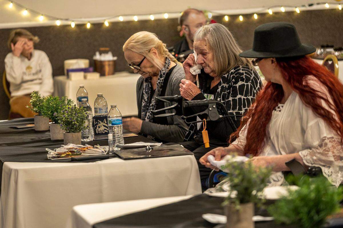 Lou Rippee, center, wipes tears at the memorial for her son James Mark Rippee at the Vacaville Moose Lodge in Vacaville on Friday. She and her daughter’s Linda Rippee Privatte, left, and Catherine J. Rippee Hanson, right, all spoke at the service.