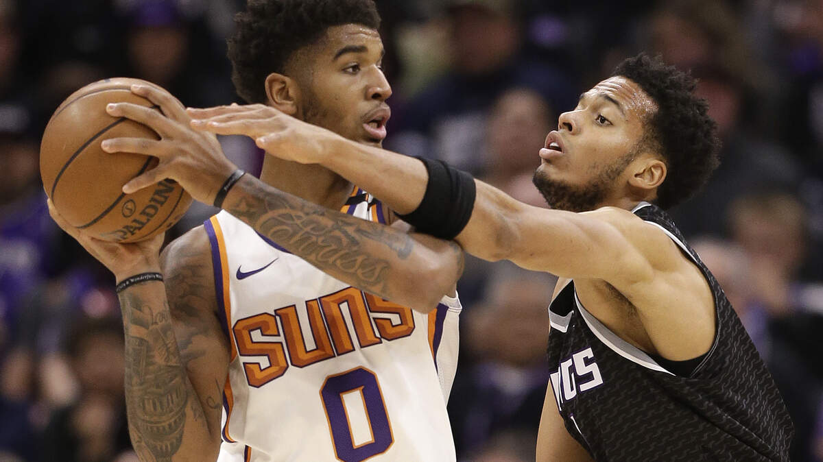 Phoenix Suns forward Marquese Chriss, left, is guarded by Kings forward Skal Labissiere on Dec. 12, 2017, in Sacramento. Chriss, a Pleasant Grove High School graduate, was traded to the Houston Rockets on Thursday night, according to ESPN’s Adrian Wojnarowski. Chriss was drafted by the Kings in 2016 but immediately traded to the Suns for three players, including Labissiere.