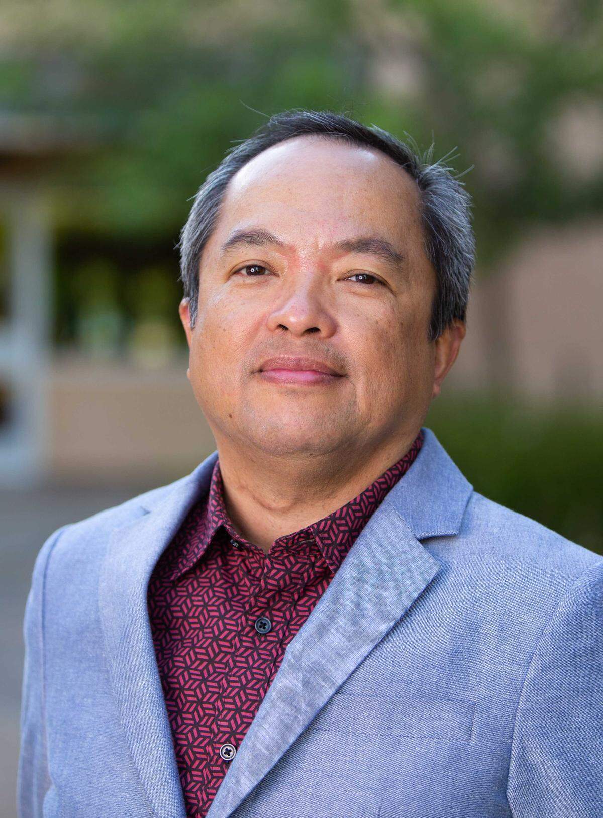 Jun Reina, former general manager at Capital Public Radio, has been charged with embezzlement, grand theft and forgery.