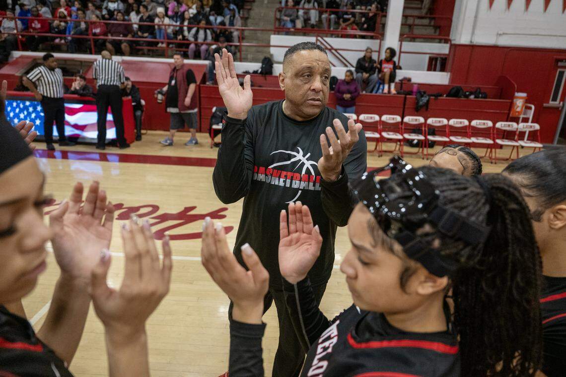 Antelope Titans head coach Sean Chambers rallies his team before the start of the second half against the McClatchy Lions in Sacramento on Friday.