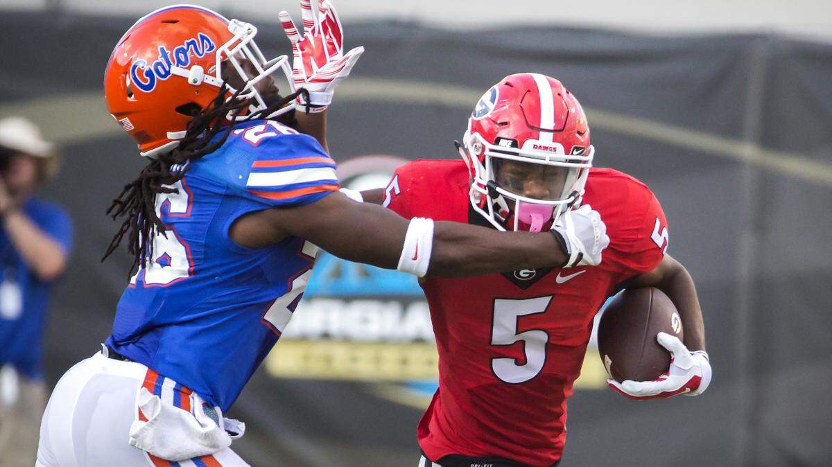 Georgia wide receiver Terry Godwin (5) is tackled by Florida defensive back Marcell Harris (26) during the second half of an NCAA football game, Saturday, Oct. 29, 2016, in Jacksonville, Fla. Florida beat Georgia 24-10.