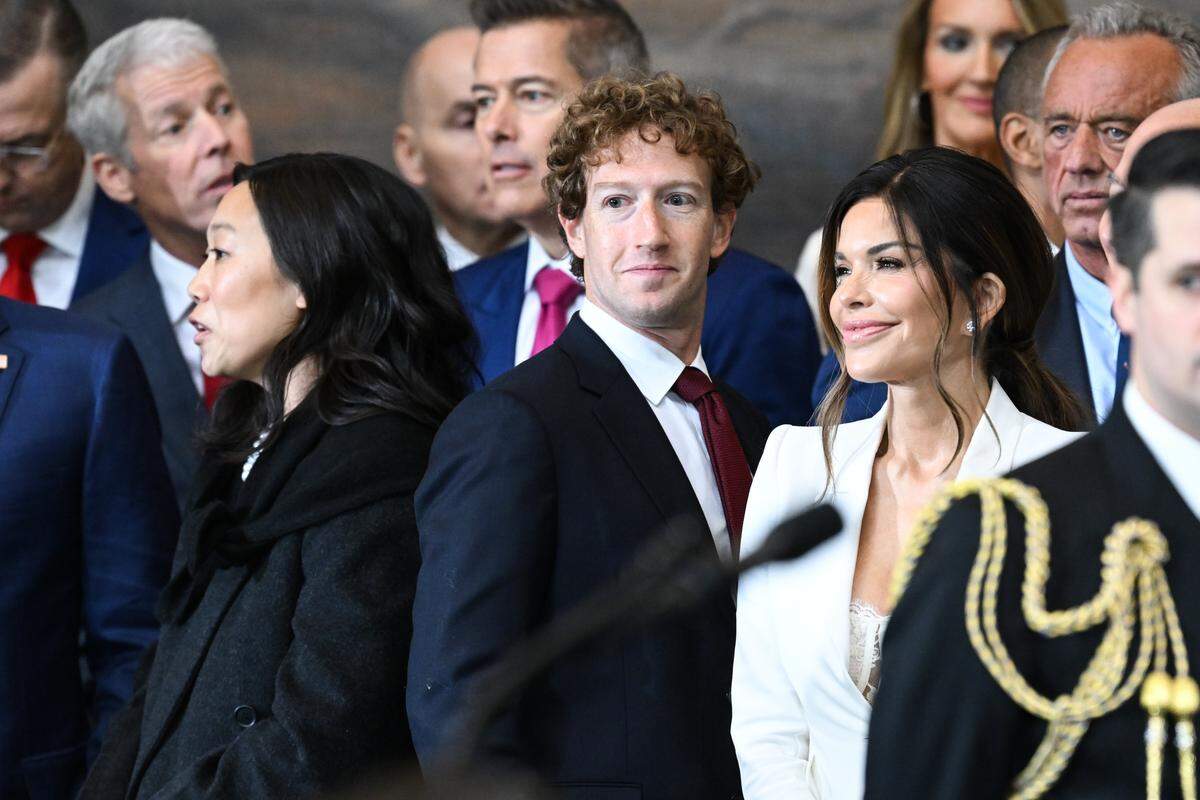 Jan 20, 2025; Washington, DC, USA; (L-R) Priscilla Chan, CEO of Meta and Facebook Mark Zuckerberg, and Lauren Sanchez attend the inauguration ceremony before Donald Trump is sworn in as the 47th US President in the US Capitol Rotunda in Washington, DC, on January 20, 2025.  Mandatory Credit: Saul Loeb-Pool via Imagn Images