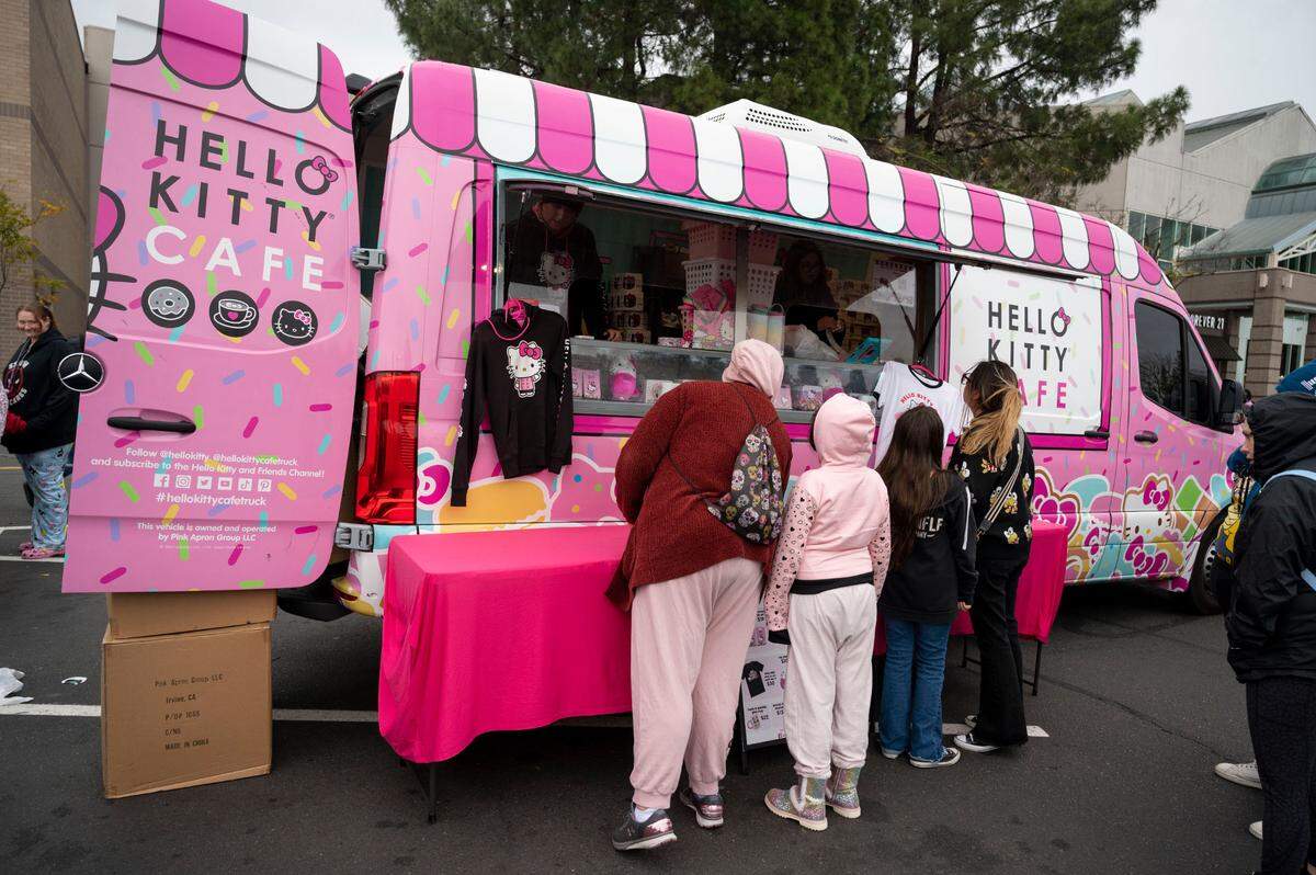 Customers line up at the Hello Kitty Cafe Truck parked at Arden Fair mall in Sacramento on Jan. 6, 2024.