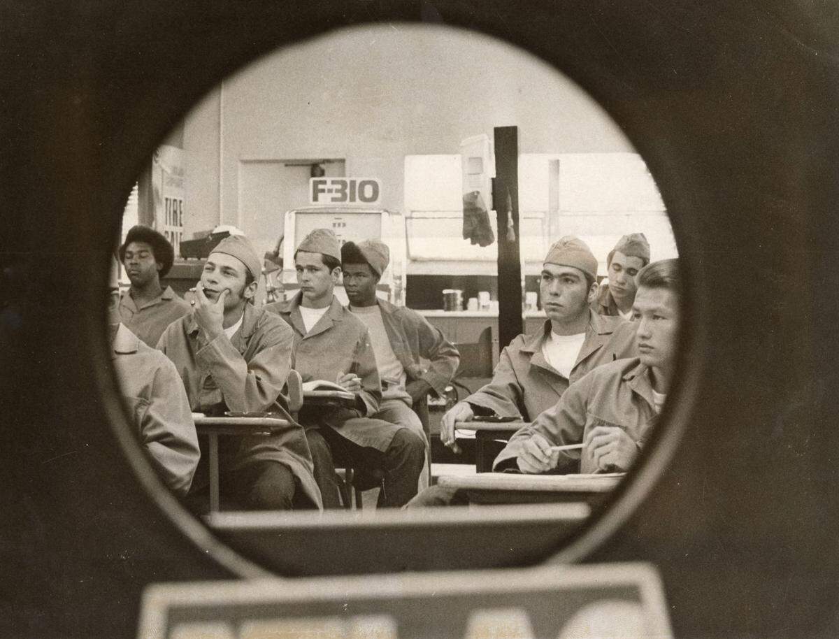 Preston wards in a class to become gas station attendants are framed by a tire display at the Preston School of Industry in Ione in May 1972. The program was a joint effort by Standard Oil and the California Youth Authority.