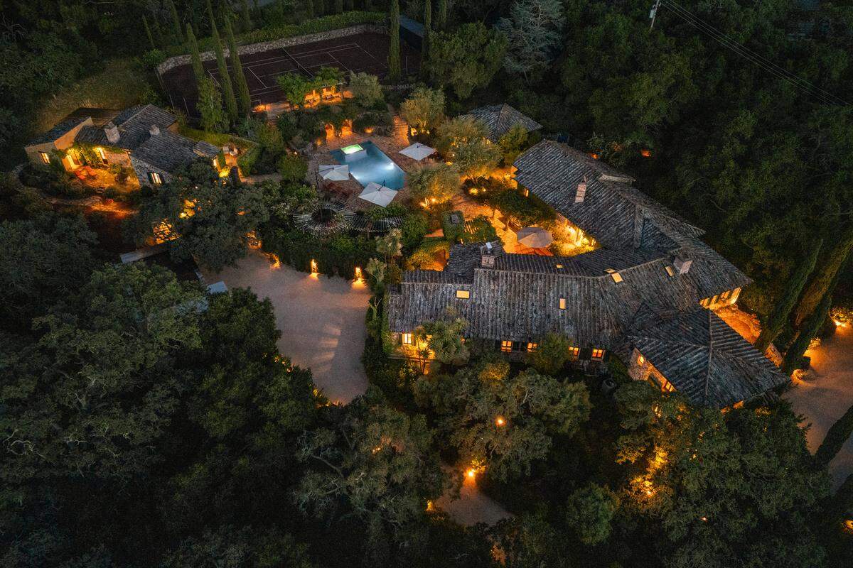 The Woodside, California, home sits on 3.2 acres — a French country estate with pool, red clay tennis court and 3,000-bottle cellar, listed for $14.9M.