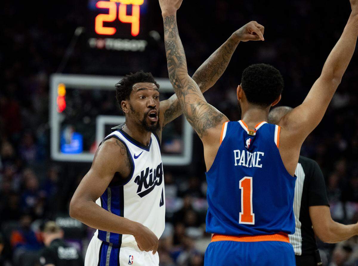 \s09\ points to New York Knicks guard Cameron Payne (1) who fouled Sacramento Kings guard Devin Carter (22) during a NBA game at Golden 1 Center on Monday, March 10, 2025, in Sacramento.