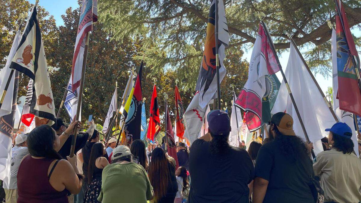Representatives from nearly 100 federally recognized tribes hold up their nation’s flags at the Capitol on Friday. The celebration marked the 57th annual California Native American Day in the state.