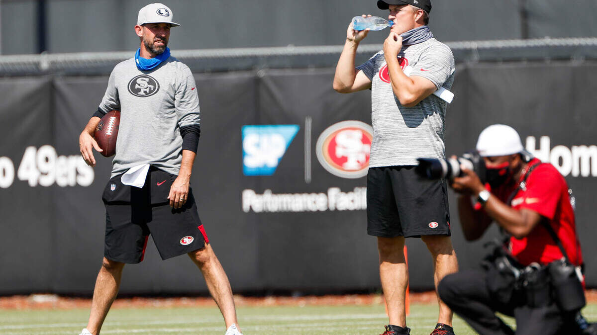 San Francisco 49ers head coach Kyle Shanahan, left, and general manager John Lynch, right, talk during practice at Levi’s Stadium in Santa Clara, Calif., on Sunday, Aug. 16, 2020. (Randy Vazquez/ Bay Area News Group)