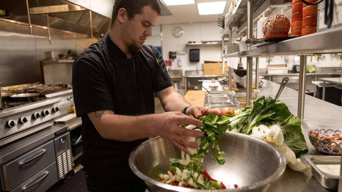 Executive chef David Brannon prepares locally sourced vegetables for dinner at Laguna Springs Independent Living Community in Elk Grove on Thursday, Jan. 12, 2023.