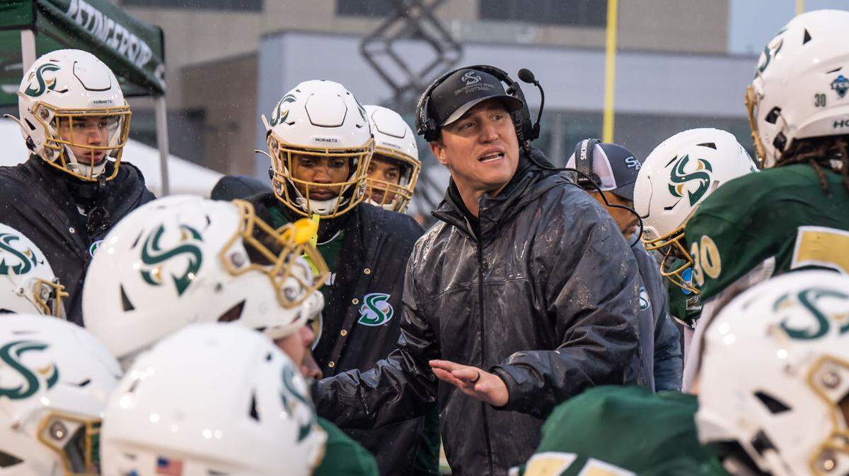 Sacramento State defensive coordinator Andy Thompson talks with players on the sideline as they play against Richmond during the NCAA FCS college football playoff game on Dec. 3 at Hornet Stadium.