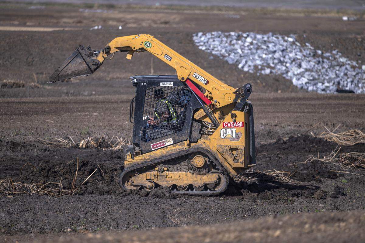 An earth mover works on the construction of habitat for the Natomas Basin Conservancy in Sutter County on Nov. 10.