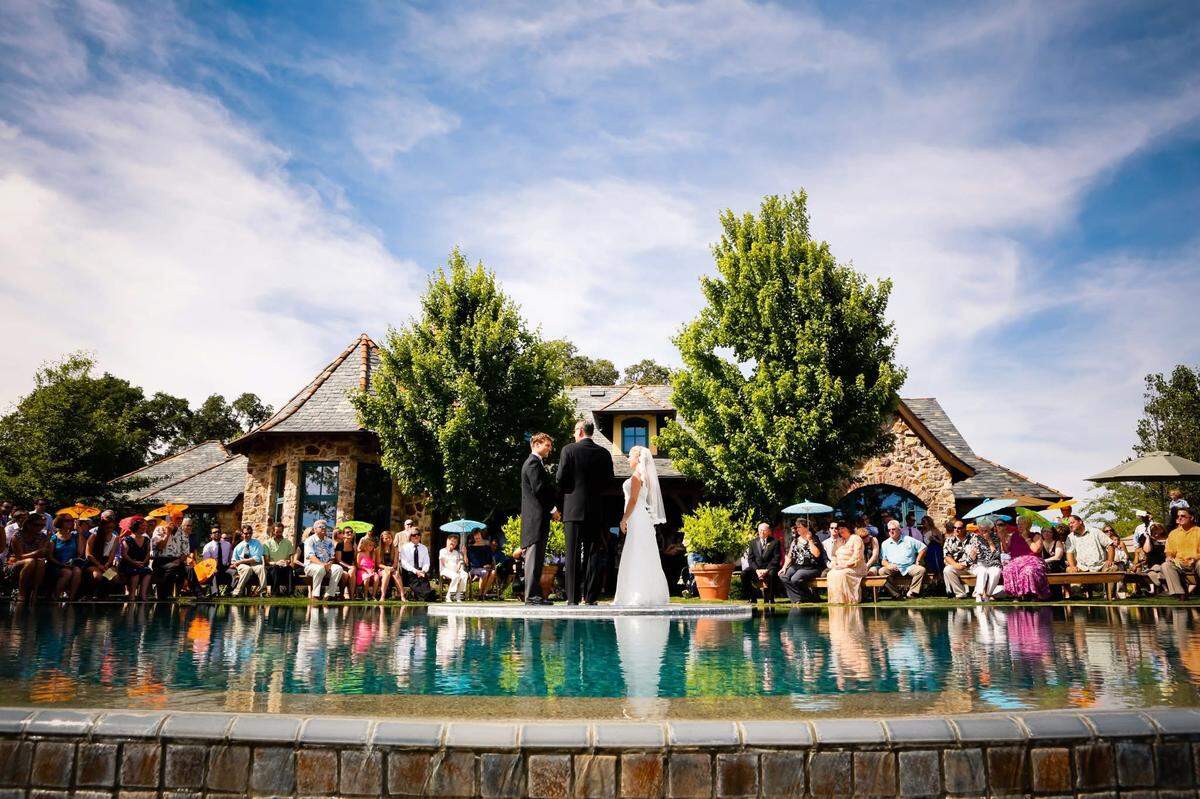 Ryan and Randi Smith were married on a clear platform atop the spa in the center of the infinity pool, giving the illusion that they were standing on water.