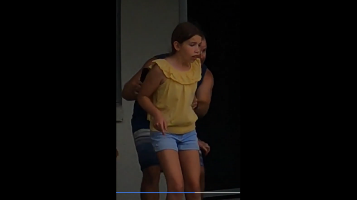 An Australian man is getting kidded for hiding behind his daughter when a snake was caught in his yard.