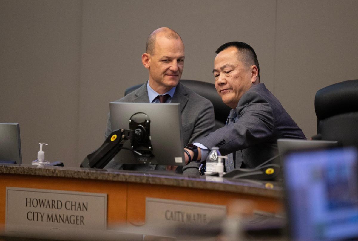 Sacramento Mayor Kevin McCarty speaks with City Manager Howard Chan after the City Council voted not to retain him on Tuesday, Dec. 17, 2024.