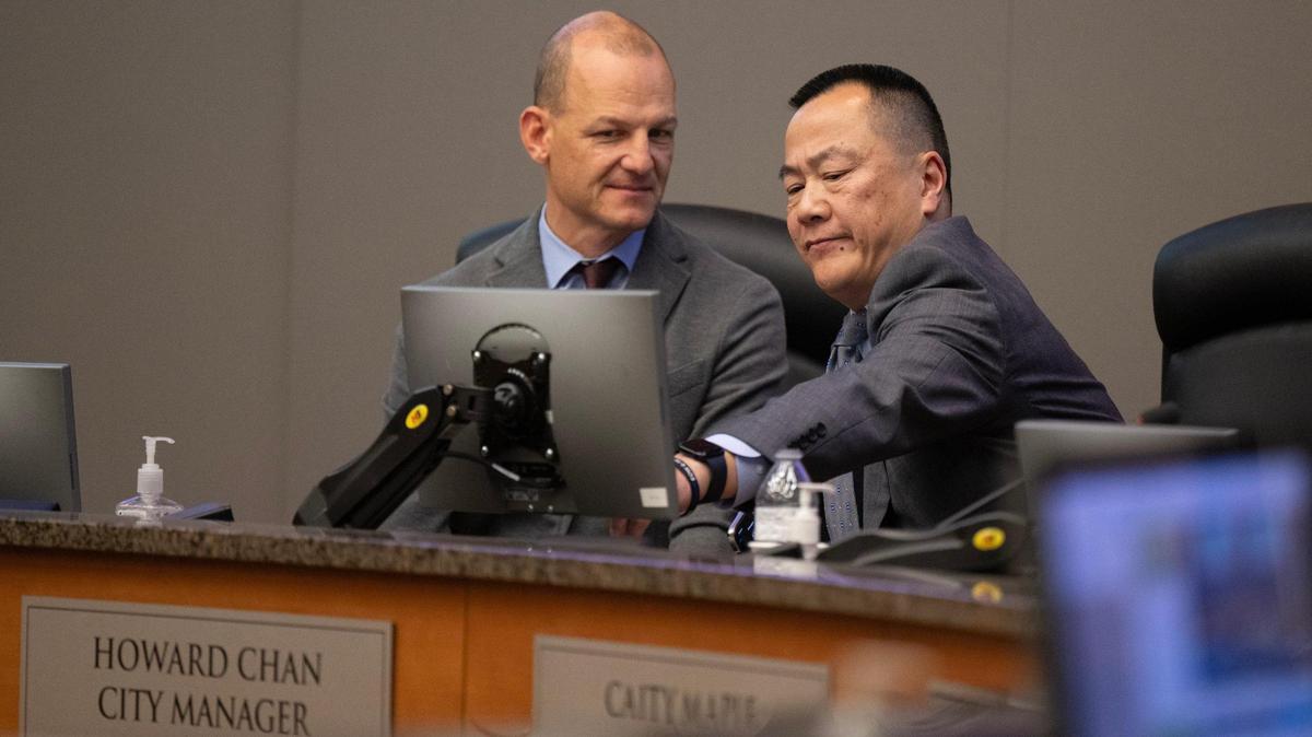 Sacramento Mayor Kevin McCarty speaks with City Manager Howard Chan after the City Council voted not to retain him on Tuesday, Dec. 17, 2024. The city shows signs of a staff culture of siphoning benefits that mimics the former city’s manager’s pursuit of higher pay.