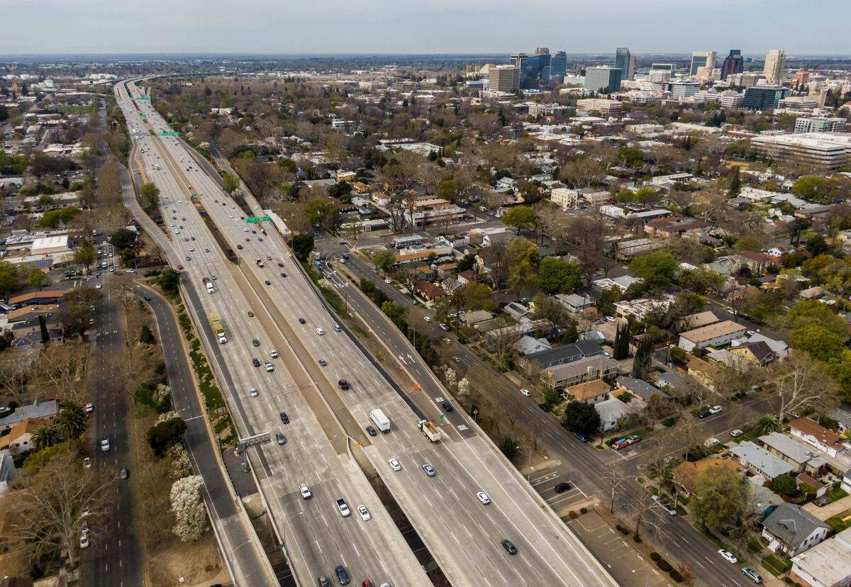 Cars drive on the W-X segment of Highway 50 through Sacramento on March 22, 2021, the day Caltrans formally launched a $460 million project that would add carpool lanes by filling in the gap between the eastbound and westbound lanes.
