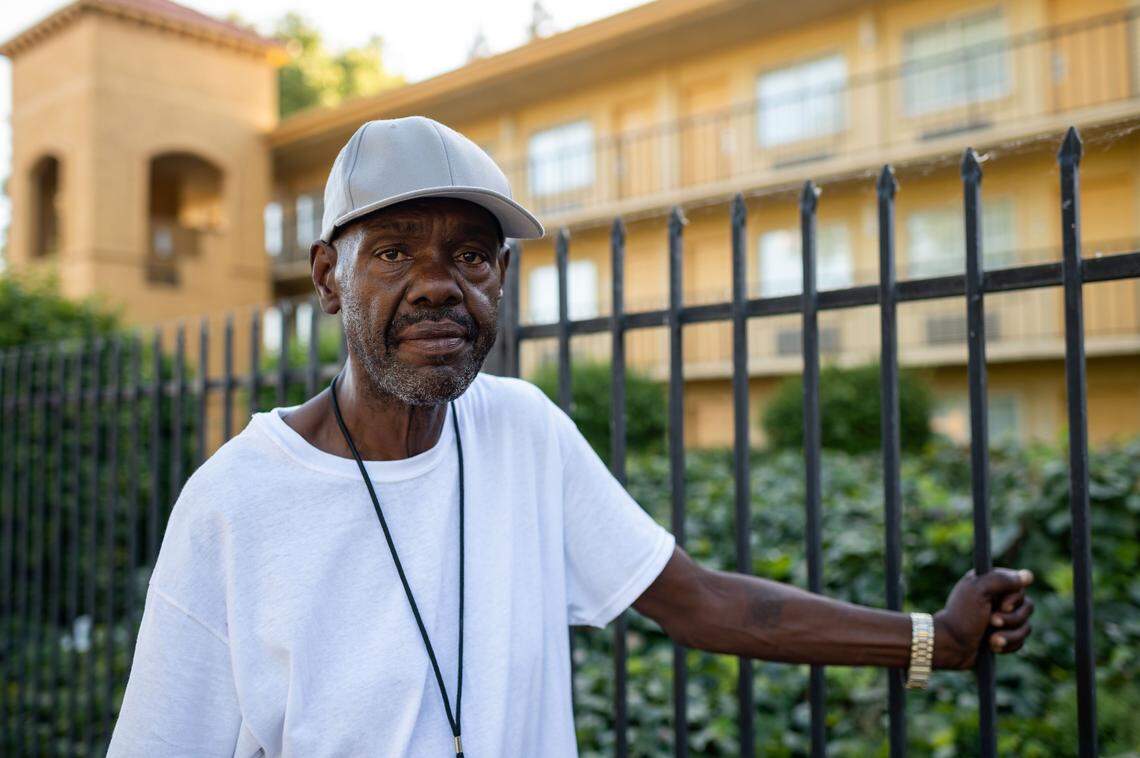 Curtis Freeman, photographed Thursday, May 28, 2020, was sleeping in a tent under the W-X freeway but is now staying at La Quinta on Jibboom Street, seen behind him, in Sacramento. He was placed in the room with help from the Sacramento Poor Peoples Campaign, as part of Gov. Gavin Newsoms Project Roomkey initiative to shelter homeless people during the coronavirus crisis.