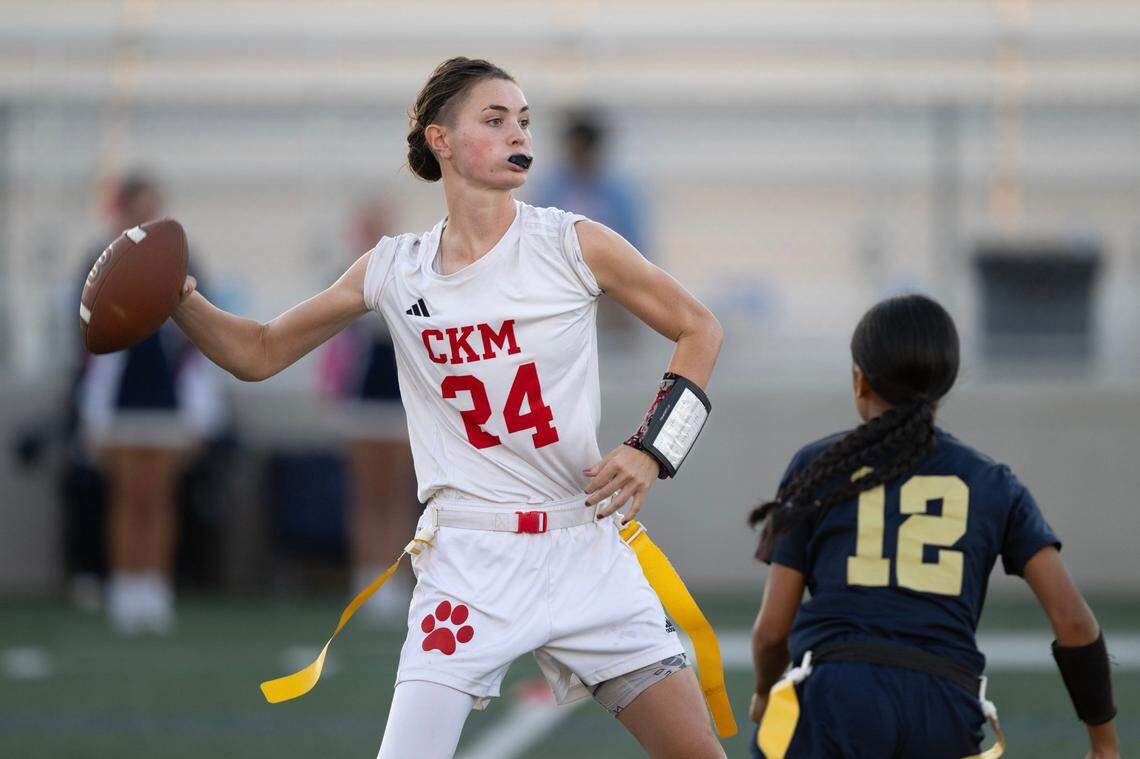 McClatchy Lions quarterback Daisy Throckmorton (24) drops back to pass in a flag football game in October. The junior is The Bee’s Offensive Player of the Year.