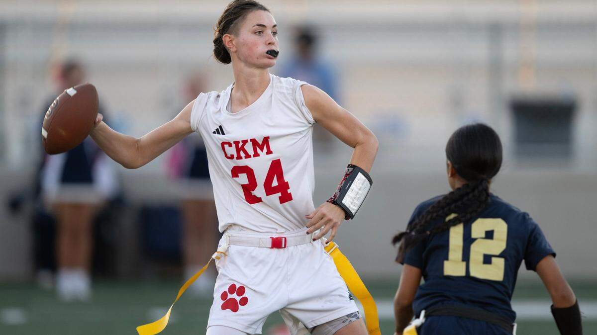 McClatchy Lions quarterback Daisy Throckmorton (24) drops back to pass as the West Park Panthers’ Althea Mamcang (12) defends in a flag football game Tuesday, Oct. 15, 2024 in Roseville.