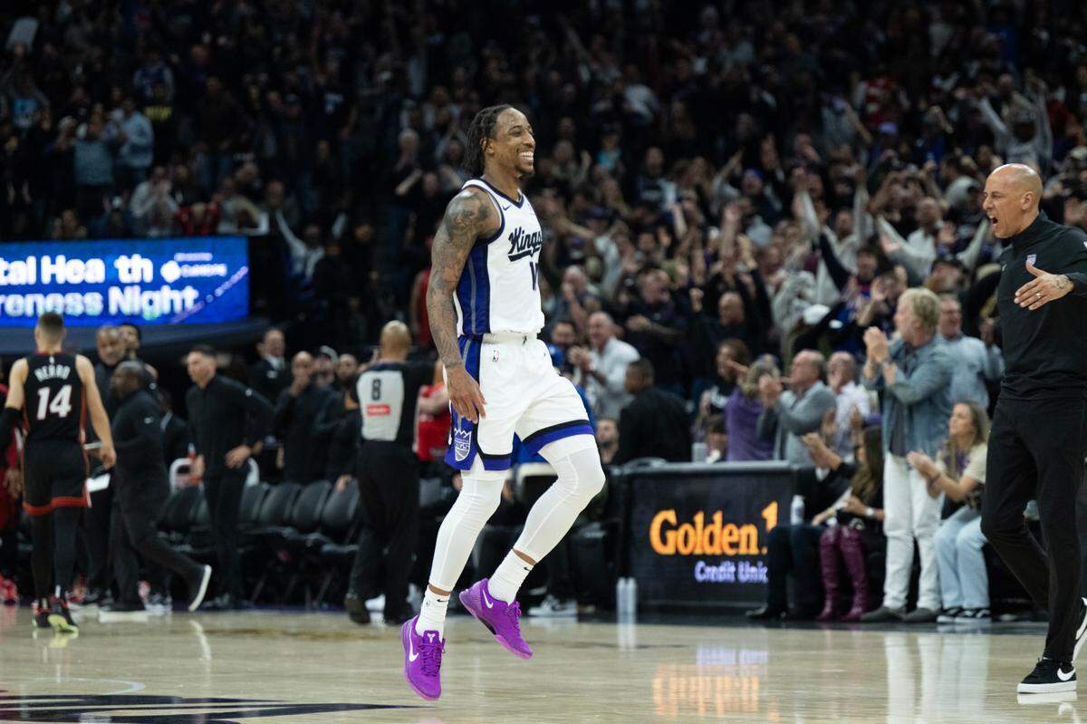 Sacramento Kings forward DeMar DeRozan (10) reacts after a 3-point basket over Miami Heat guard Tyler Herro (14) in double overtime to end the game during an NBA game at Golden 1 Center on Monday, Jan. 6, 2025, in Sacramento.