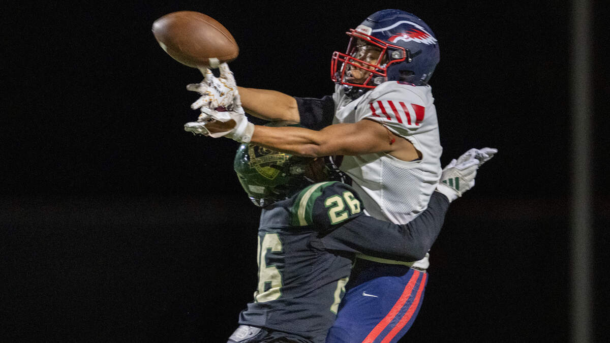 The Monterey Trail Mustangs' Ian Guerrero (26) is called for pass interference as the Pleasant Grove Eagles' Ivan Saeyang (8) was unable to make the catch in the second half on Friday in Elk Grove.