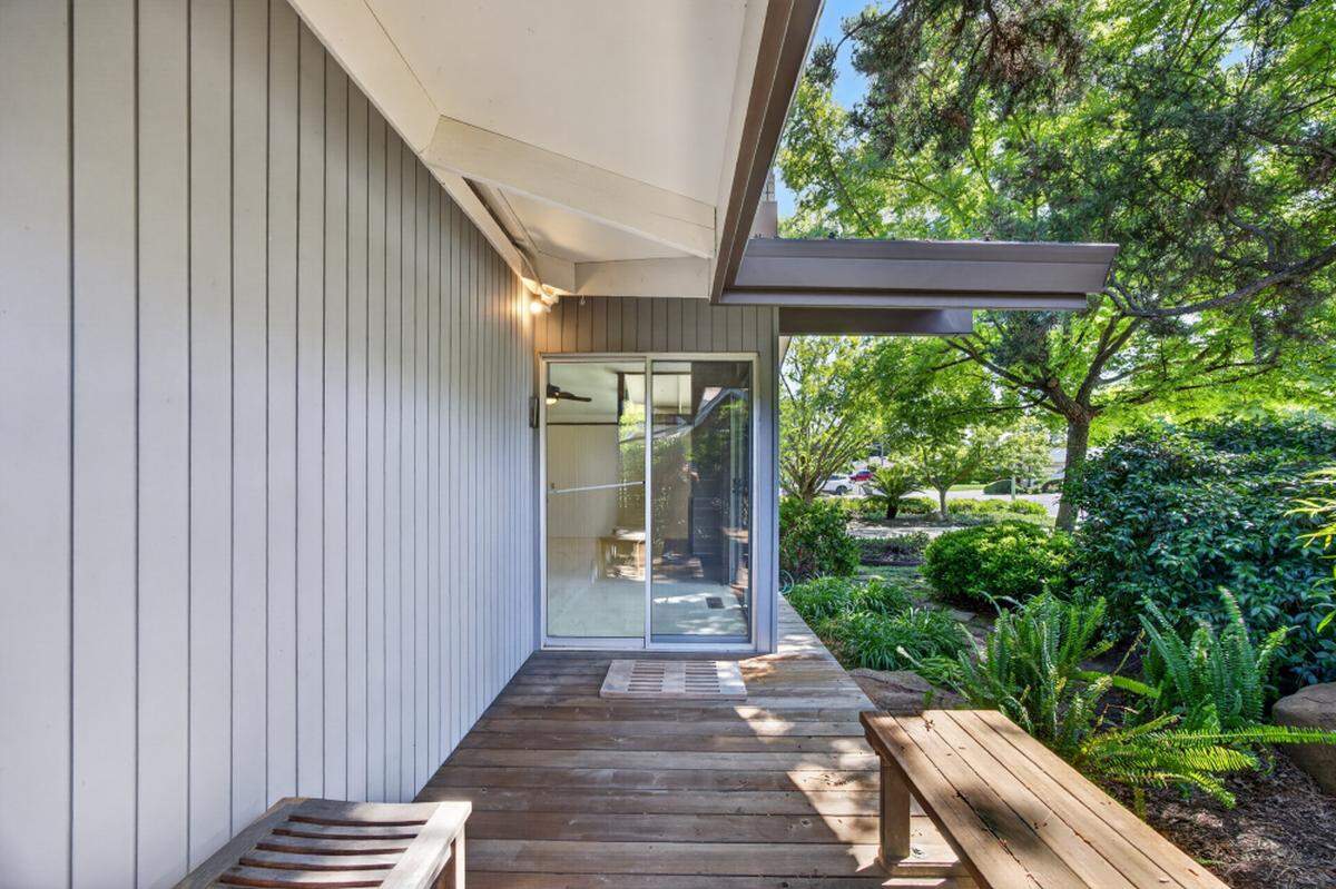 Clerestory windows and exposed beams pull daylight deep into the 1968 structure. 