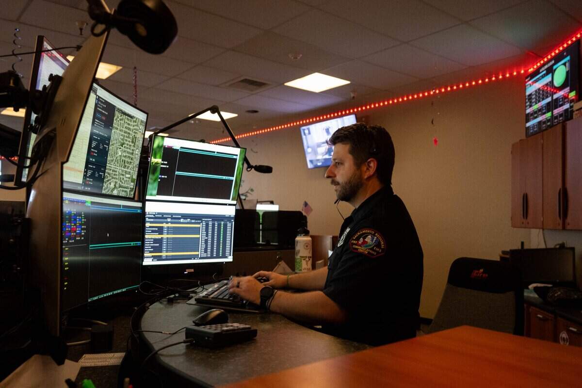 Dispatcher Nolan Saulter answers a 911 call at the Sacramento Regional Fire/EMS Communications Center on Friday in Rancho Cordova. The center, which dispatches for 10 fire departments across Sacramento County, handles its highest call volume of the year on the Fourth of July.