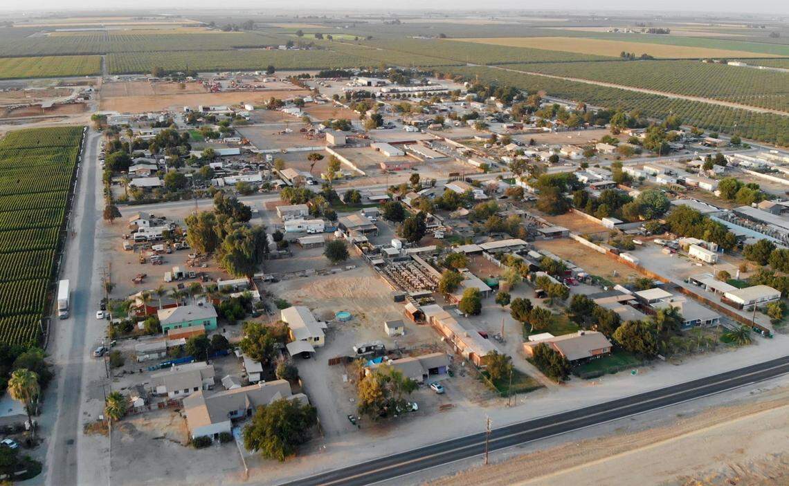 The community of Okieville, seen Friday, Aug. 13, 2021, in Tulare County. Five years ago, after residential wells in the Okieville area failed, the residents formed a water company and secured millions of state and federal dollars to drill a well and build a community system. This year, though, the pump motor has been failing frequently, leaving the 72 homes connected to the system without water for hours at a time.