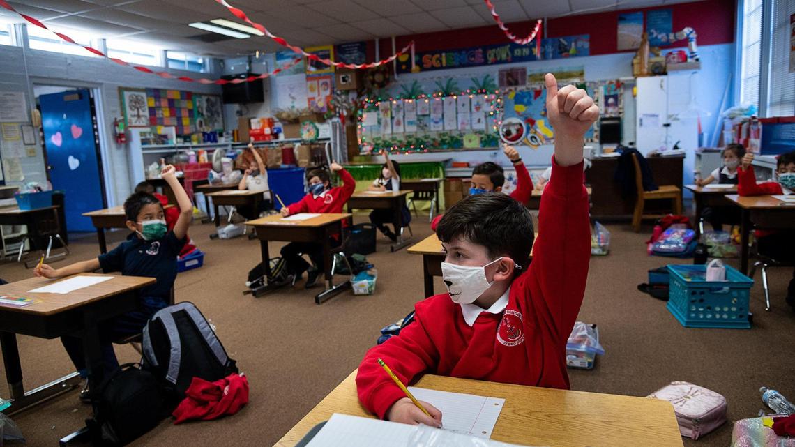 Joseph Markstein, 7, wears a face mask during his first-grade class at Saint Philomene School on Feb. 10, 2021, in Sacramento.