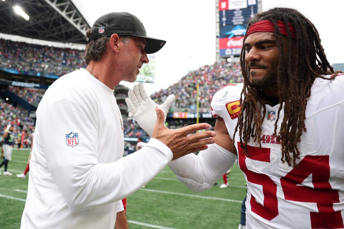SEATTLE, WASHINGTON - SEPTEMBER 07: Head coach Kyle Shanahan of the San Francisco 49ers celebrates with Fred Warner #54 after defeating the Seattle Seahawks during the game at Lumen Field on September 07, 2025 in Seattle, Washington. (Photo by Steph Chambers/Getty Images)