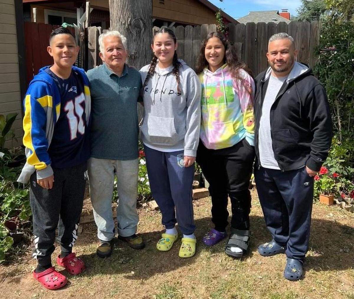 Juan Ramon Flores, second from left, poses with grandchildren Isaiah, Jennifer and MacKayla, and his son, Walter Flores. Juan was on a walk in Del Paso Heights when he was fatally struck by a driver in 2023.