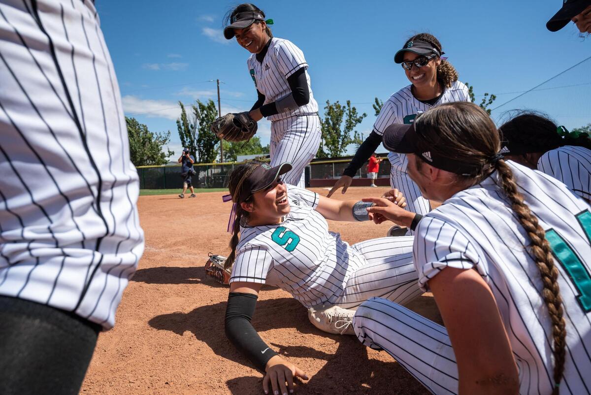 Sheldon pitcher Breanna Romero gets up after a team pile celebrating the Huskies’ 7-1 win over Lincoln, of Stockton, at the Sac-Joaquin Section Division I high school softball championship game Saturday at Sacramento City College.
