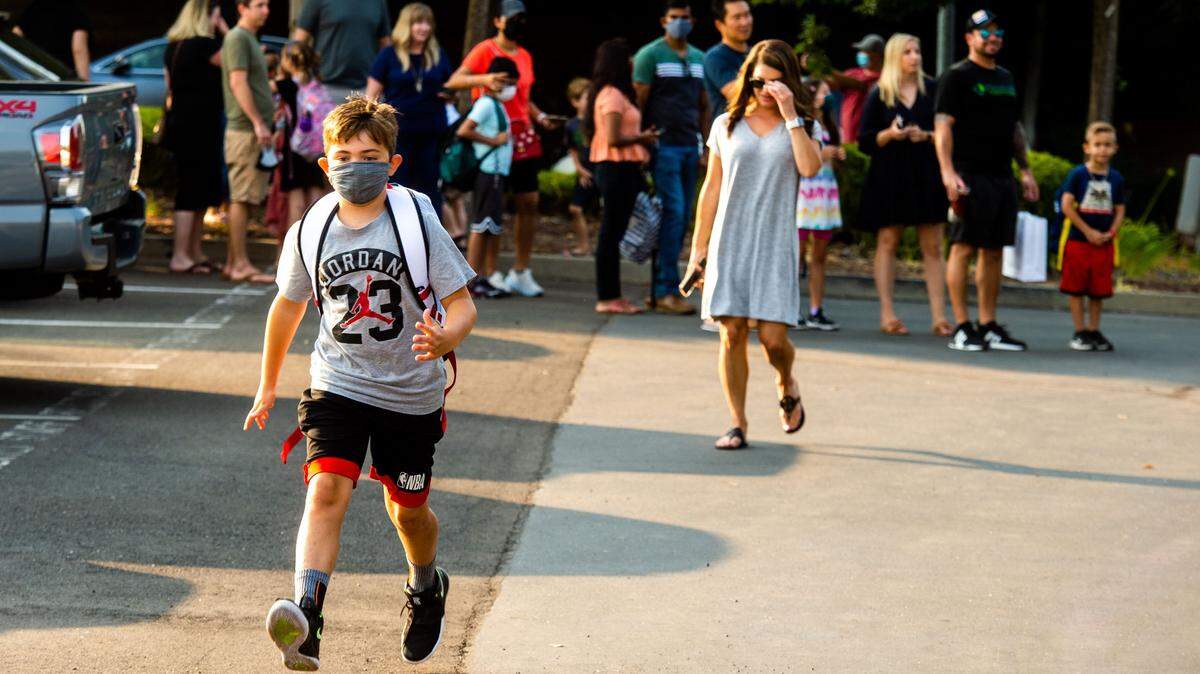 Fourth grader Maxwell Boytin heads to class on the first day of school at Empire Oaks Elementary School in Folsom on Wednesday, Aug. 11, 2021.
