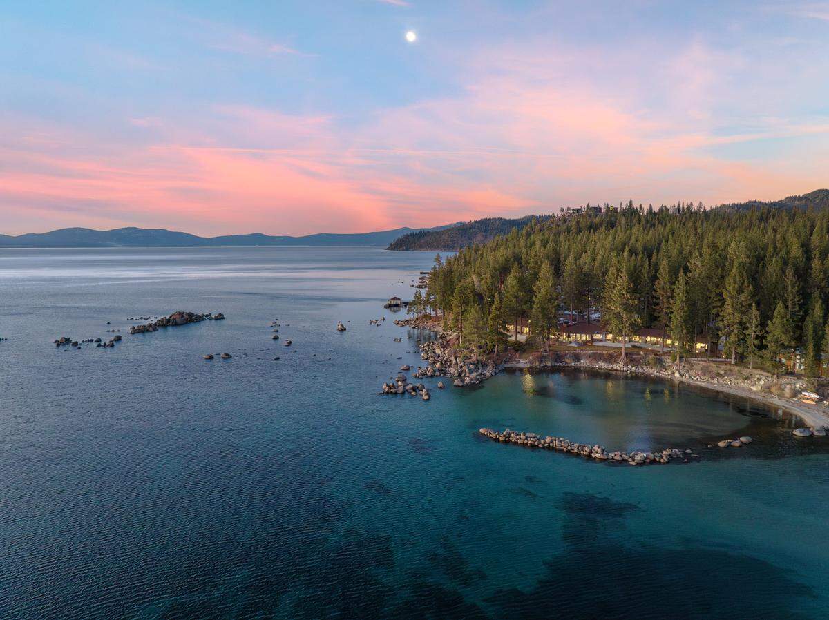 For sale for $65 million, this Glenbrook, Nevada home on the shores of Lake Tahoe provides a protected area allowing for swimming in calm waters.