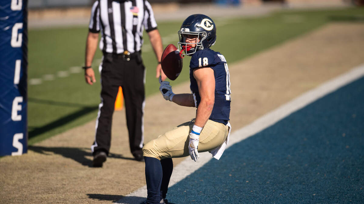 UC Davis Aggies quarterback Trent Tompkins (18) runs the ball in for a touchdown against Idaho State during the fourth quarter of the college football game Saturday, March 27, 2021, at UC Davis Health Stadium. UC Davis beat Idaho 31-27.