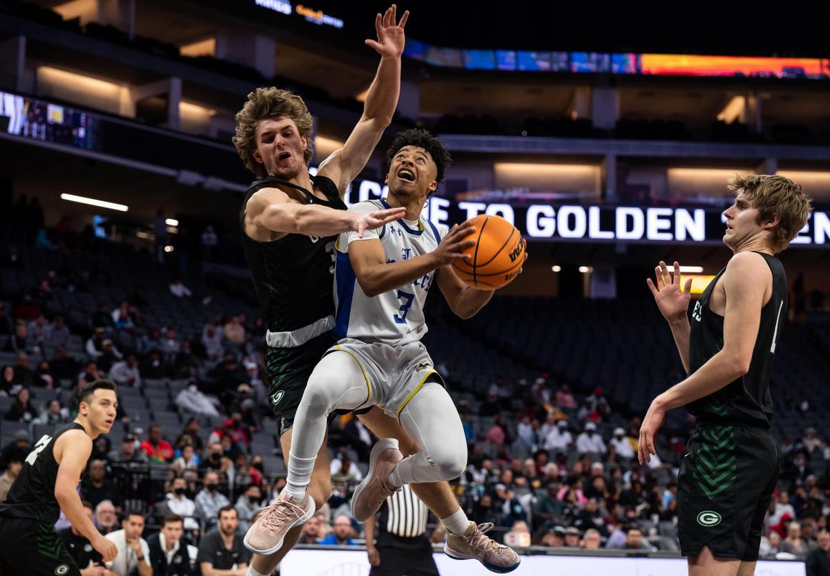 Grant Pacers’ Jayson Mathews (3) goes up for a shot as Granite Bay Grizzlies’ Brody Sanchez (33), left, and TJ Maveety defend during the first period at the high school boys basketball Sac-Joaquin Section Division II championship game Friday, Feb. 25, 2022, at Golden 1 Center in Sacramento. Grant beat Granite Bay, 65-58, for the title.
