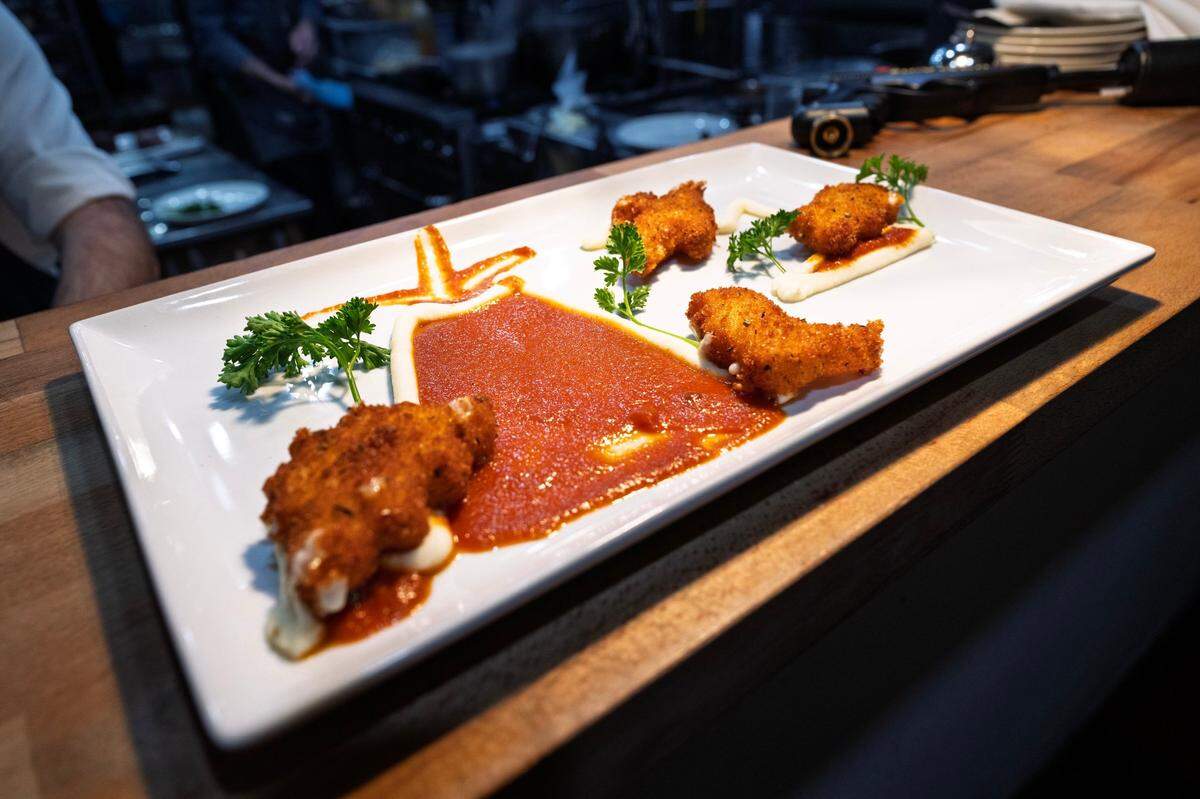The plate of Dino-Motz, mozzarella sticks formed into dinosaur shapes and fried, is served at Daniello’s on Friday, Oct. 19, 2024.