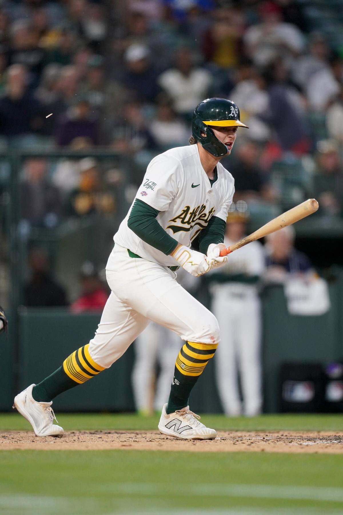 Apr 23, 2025; West Sacramento, California, USA; Athletics first baseman Nick Kurtz (16) hits a ground ball against the Texas Rangers in the second inning at Sutter Health Park. Mandatory Credit: Cary Edmondson-Imagn Images