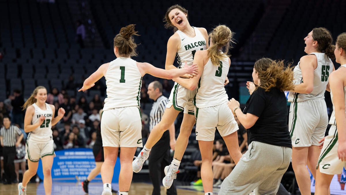 Colfax’s Grace Clark (11) is picked up by Maycee Heimann (3) and Gabriella Bitter (1) after their team defeated the Riverbank Bruins 56-38 during the CIF Sac-Joaquin Section Division IV high school girls basketball championship game Friday.