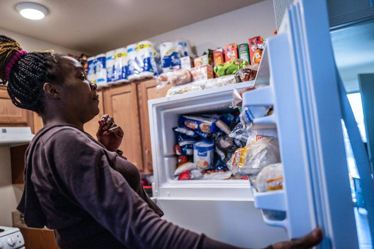 Marquisha Brown prepares to make dinner at home with groceries she was able to purchase with help from the Yolo Basic Income program. The pilot program is focused on families with children under age 6. It provides additional cash benefits, usually between $1,200 and $1,500 per month, enough to put a family’s monthly income $1 over a statewide measure of poverty.