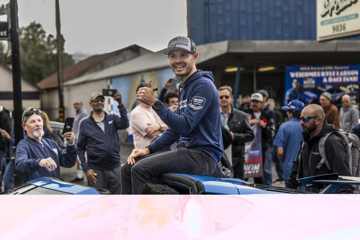 NASCAR driver Kyle Larson gives a thumbs up to fans Friday as he’s celebrated with a parade in his hometown of Elk Grove after winning his second NASCAR Cup Series Championship earlier this month.