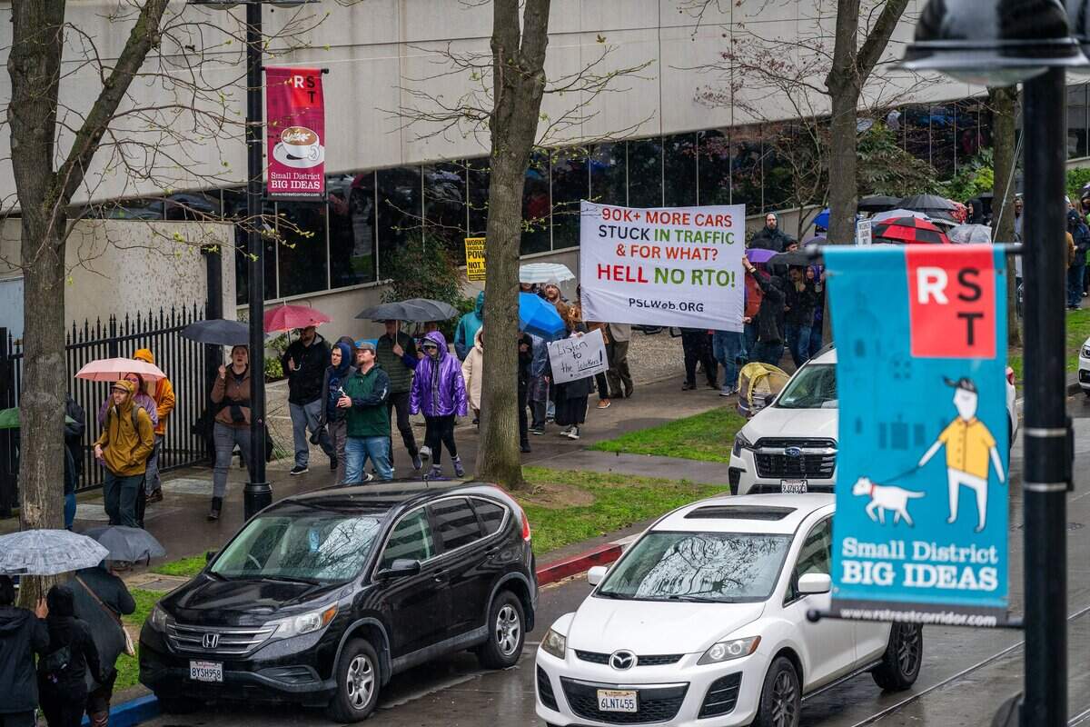 State workers march holding signs around the CalHR offices in Sacramento in March 2025 as they protest Gov. Gavin Newsom’s order directing them to return to their offices. The state offers a variety of resources and programs to help employees adjust to change.