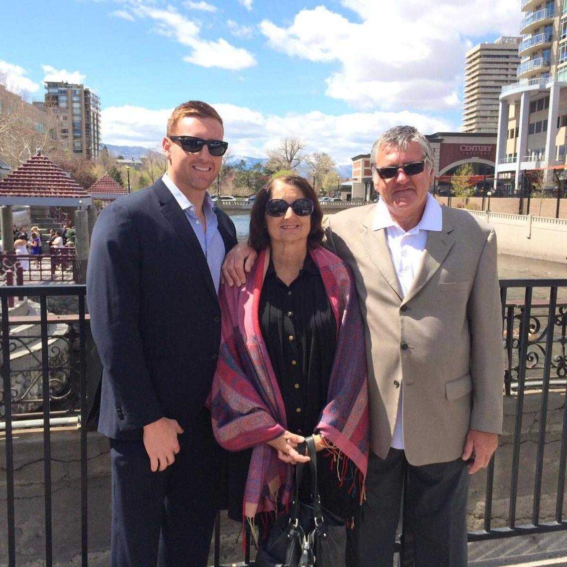 Joshua Pickles and his parents, Paula Bozinovich and Terry Pickles, snap a family photo in 2014. All three were among the eight people who died after their boat capsized on Lake Tahoe on Saturday, June 21, 2025. The family and others had been on the lake to celebrate Bozinovich’s 71st birthday when a storm triggered swells that capsized the boat.