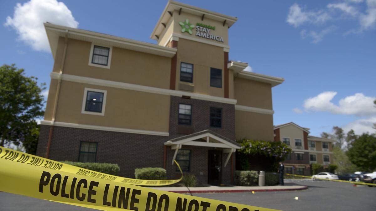 Police investigators process evidence at the Extended Stay America hotel in Elk Grove, where a fatal officer-involved shooting took place early Saturday.