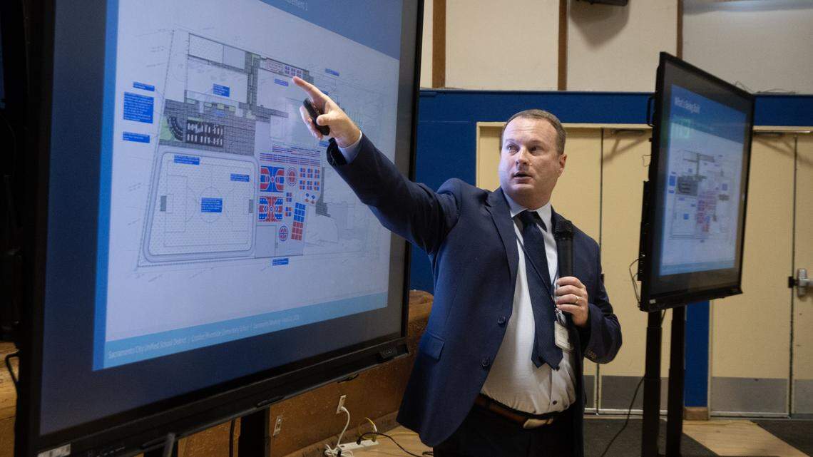Chris Ralston, assistant superintendent of facilities for Sacramento City Unified, explains the plan to replace the existing grass field at Crocker/Riverside Elementary School with artificial turf during a meeting at the school on Tuesday, April 21, 2026.