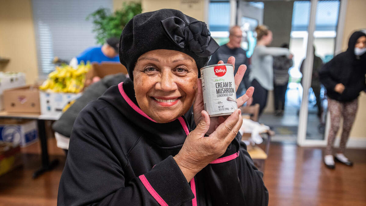 Miriam Cruz was excited to see her favorite soup was part of the Elk Grove food bank distribution at Arbor Creek Family Apartments on Nov. 21. The organization asks Book of Dreams readers for donations to resume mobile cooking classes for seniors.