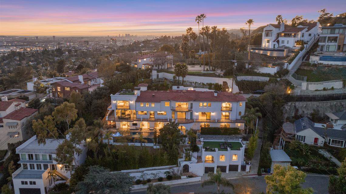 The home spans 12,650 square feet of living space with seven bedrooms and steps leading up to Griffith Observatory.