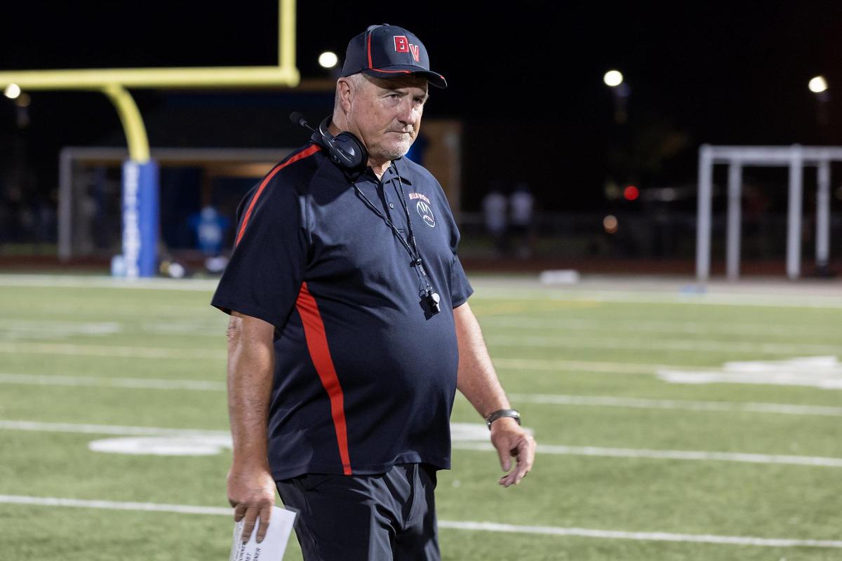Bella Vista head coach Jim Gray walks to the sidelines in 2022 at Del Campo High School in Fair Oaks. Gray’s team in 2021 ended a record-long 48-game losing streak for Bella Vista, the longest in Northern California history.